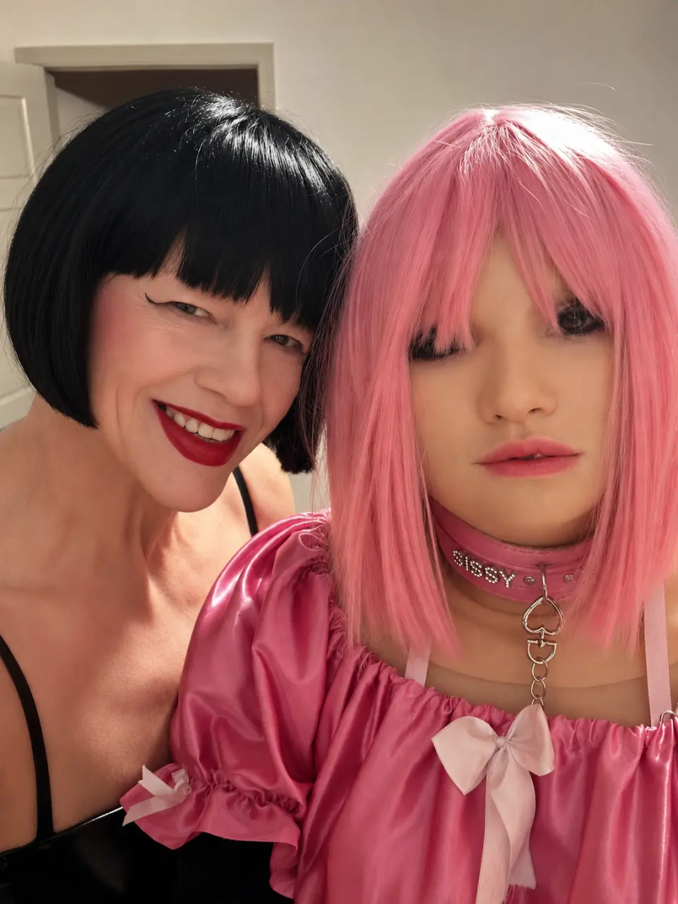 TS Mistress Mia during dollification play with a submissive in Dallas
