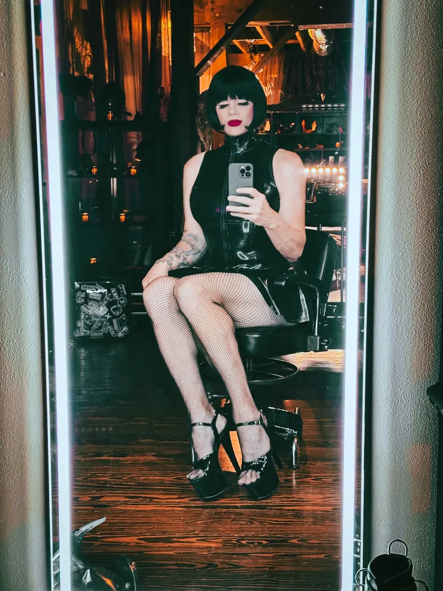 TS Mistress Mia mirror portrait in latex in her North Dallas dungeon